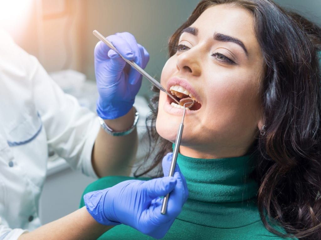 Adult patient receiving dental care