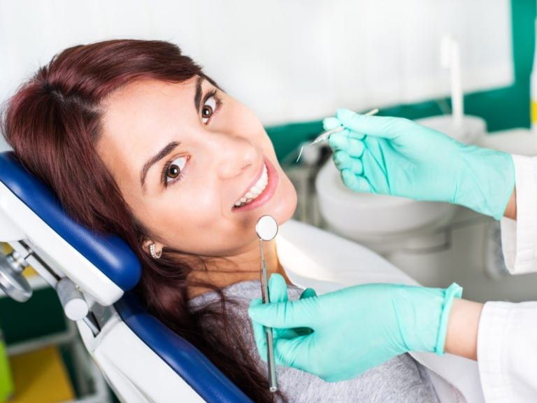 Female patient having dental checkup (Surgical Orthodontics)